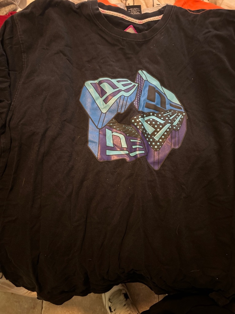 New Era Black Short Sleeve Graphic Tee with Blue and Purple Logo